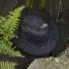 Distressed dark brown leather cowboy hat with UV50+ protection, water resistance & foldable design. Perfect for hiking, travel & urban style. Step into the wild in style with the Wombat Leather Cowboy Hat. Crafted from soft, full-grain leather with a unique distressed finish, this hat is the perfect blend of rugged outdoor appeal and urban chic.