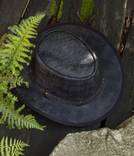 Distressed dark brown leather cowboy hat with UV50+ protection, water resistance & foldable design. Perfect for hiking, travel & urban style. Step into the wild in style with the Wombat Leather Cowboy Hat. Crafted from soft, full-grain leather with a unique distressed finish, this hat is the perfect blend of rugged outdoor appeal and urban chic.
