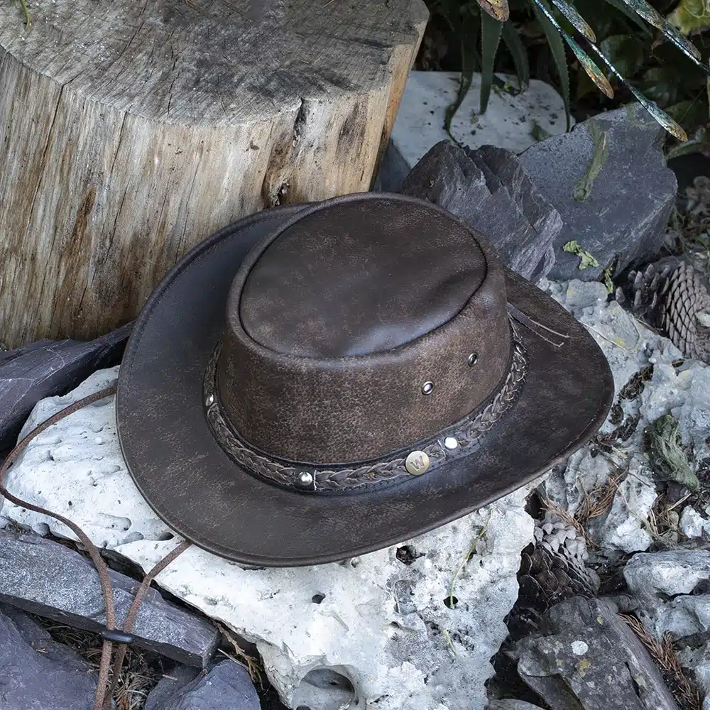 Rugged Australian Hat - Brown Leather Hat The Wilds, by Wombat – Distressed Bush Hat | Rugged Australian Style | Unisex Hats Whether you're camping, hiking, or just exploring the great outdoors, The Wilds brown Leather Hat is your perfect companion. This rugged, Australian-inspired bush hat is crafted with soft, foldable full grain leather, making it the perfect hat for travel and adventure.