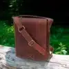wombat Oiled Leather Flapover Messenger Bag showing leather shoulder strap
