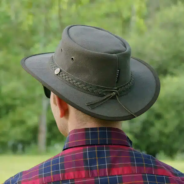 man wearing a wombat the trail thick canvas outdoor hat