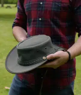 man holding a wombat the trail thick canvas outdoor hat