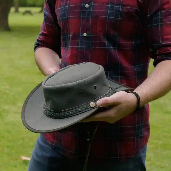 man holding a wombat the trail thick canvas outdoor hat