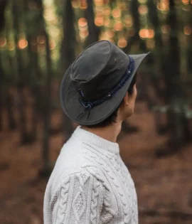 man wearing a waxed cotton hat