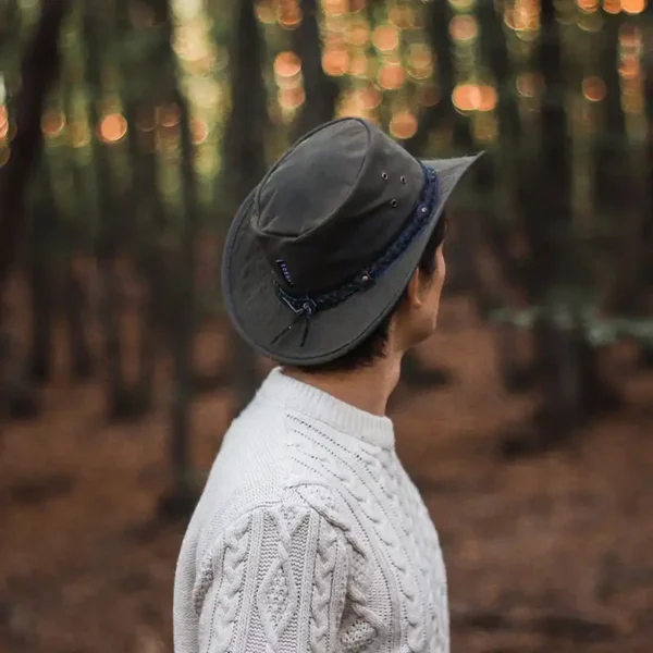 man wearing a waxed cotton hat