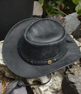 black leather hat on a stone background