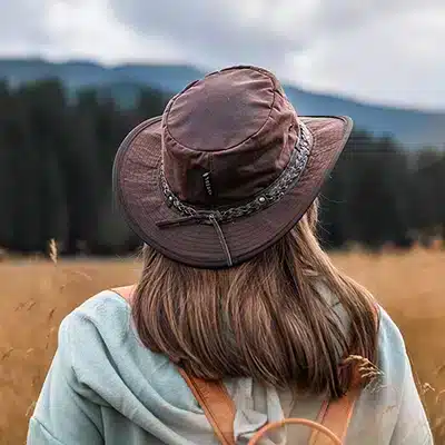woman wearing a wilderness brown wombat Outdoor hat