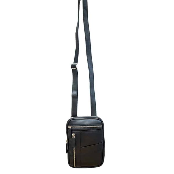 wombat Small black Leather Crossbody Travel Bag front view showing shoulder strap