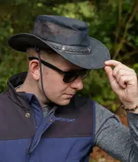 man wearing a wombat the wilds air back leather hat with mesh sides