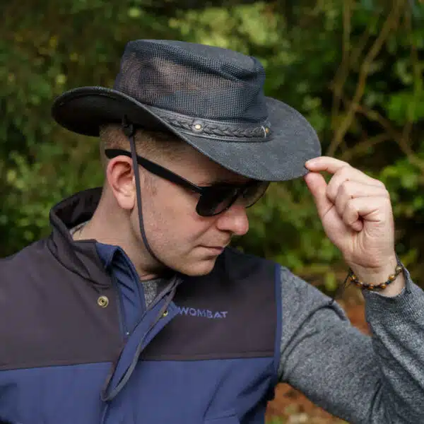 man wearing a wombat the wilds air back leather hat with mesh sides