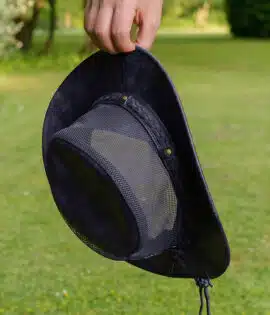 man holding a wombat the wilds air back leather hat with mesh sides