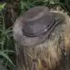 Handcrafted leather Outback hat with breathable mesh sides, foldable design, and wide brim for UV protection. Ideal for hiking, travel, and adventure. wombat
