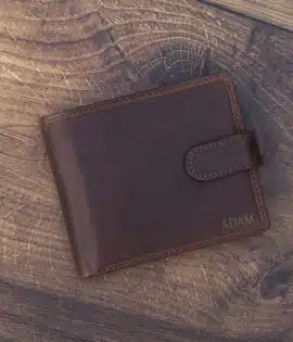 brown leather wallet on a wood background with laser embossing