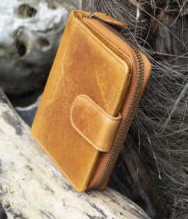 Womans Tan vintage style leather bifold purse Wallet with a tab opening side view showing metal zip purse section