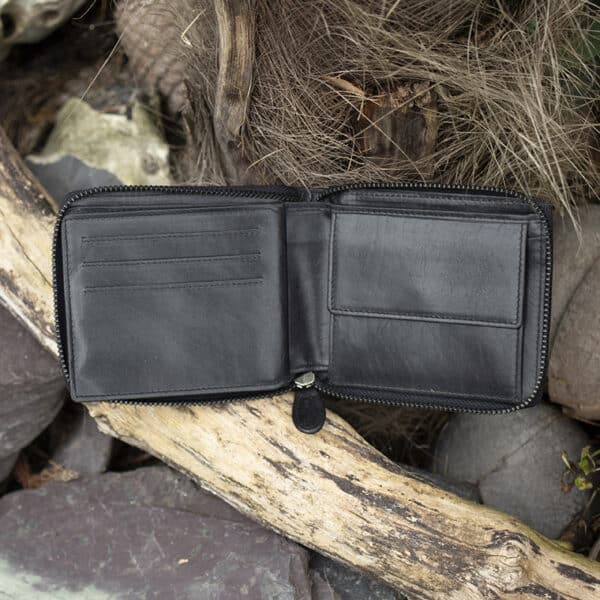 mens large leather zip around wallet in black vintage style leather showing card slots and coin pocket