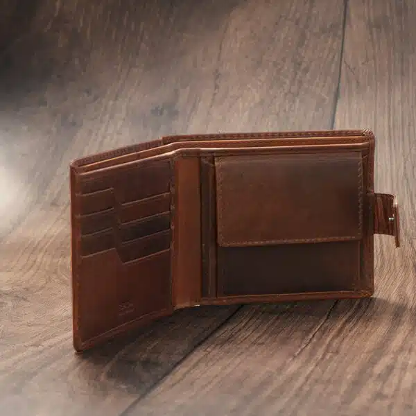 mens tan bifold wallet on a wood background open