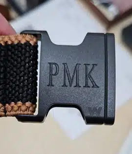 embossed initials on a belt buckle