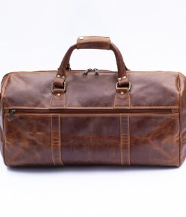 Leather travel bag side pockets and strap