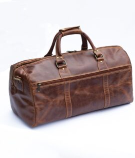 Wombat men’s brown leather travel bag with brass details