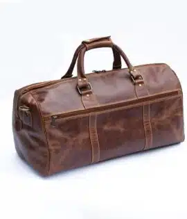 Wombat men’s brown leather travel bag with brass details