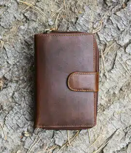 ladies purse in brown shot on a log background