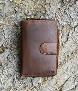 ladies purse in brown shot on a log background