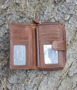 ladies purse in brown shot on a log background