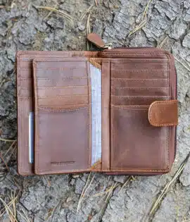 ladies purse in brown shot on a log background