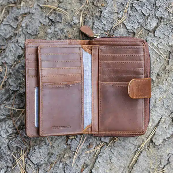 ladies purse in brown shot on a log background