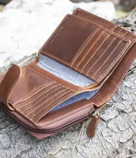 ladies purse in brown shot on a log background