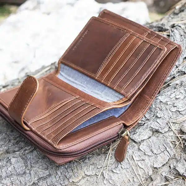 ladies purse in brown shot on a log background