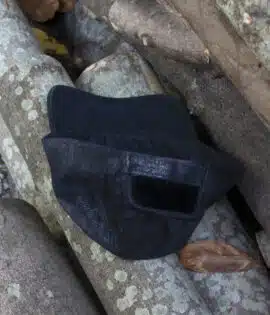 soft black leather cap with a one size velcro strap