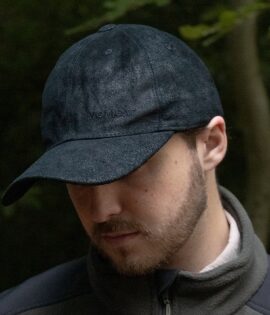 man wearing a black leather cap by wombat