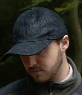 man wearing a black leather cap by wombat