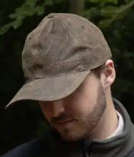 man wearing a brown leather cap by wombat