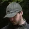 man wearing a green leather cap by wombat