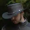 man wearing a black leather hat