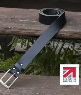 black handmade in britain leather belt on a wooden step