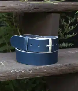 premium blue english hide leather belt on a wooden step