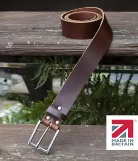 brown handmade in britain leather belt on a wooden step