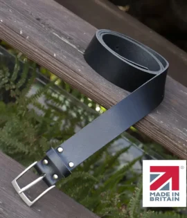 black handmade in britain leather belt on a wooden step