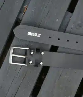 premium black english hide leather belt on a wooden step with made in britain stamp