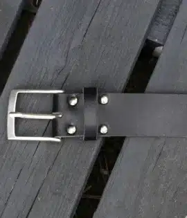 premium black english hide leather belt on a wooden step