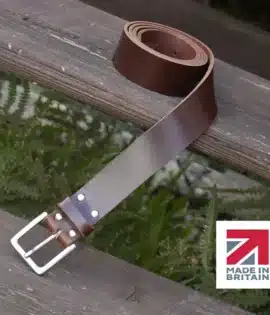 brown handmade in britain leather belt on a wooden step