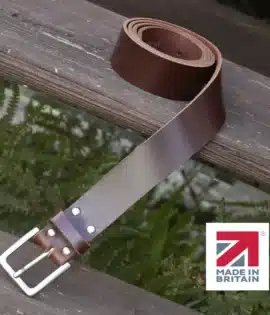 brown handmade in britain leather belt on a wooden step