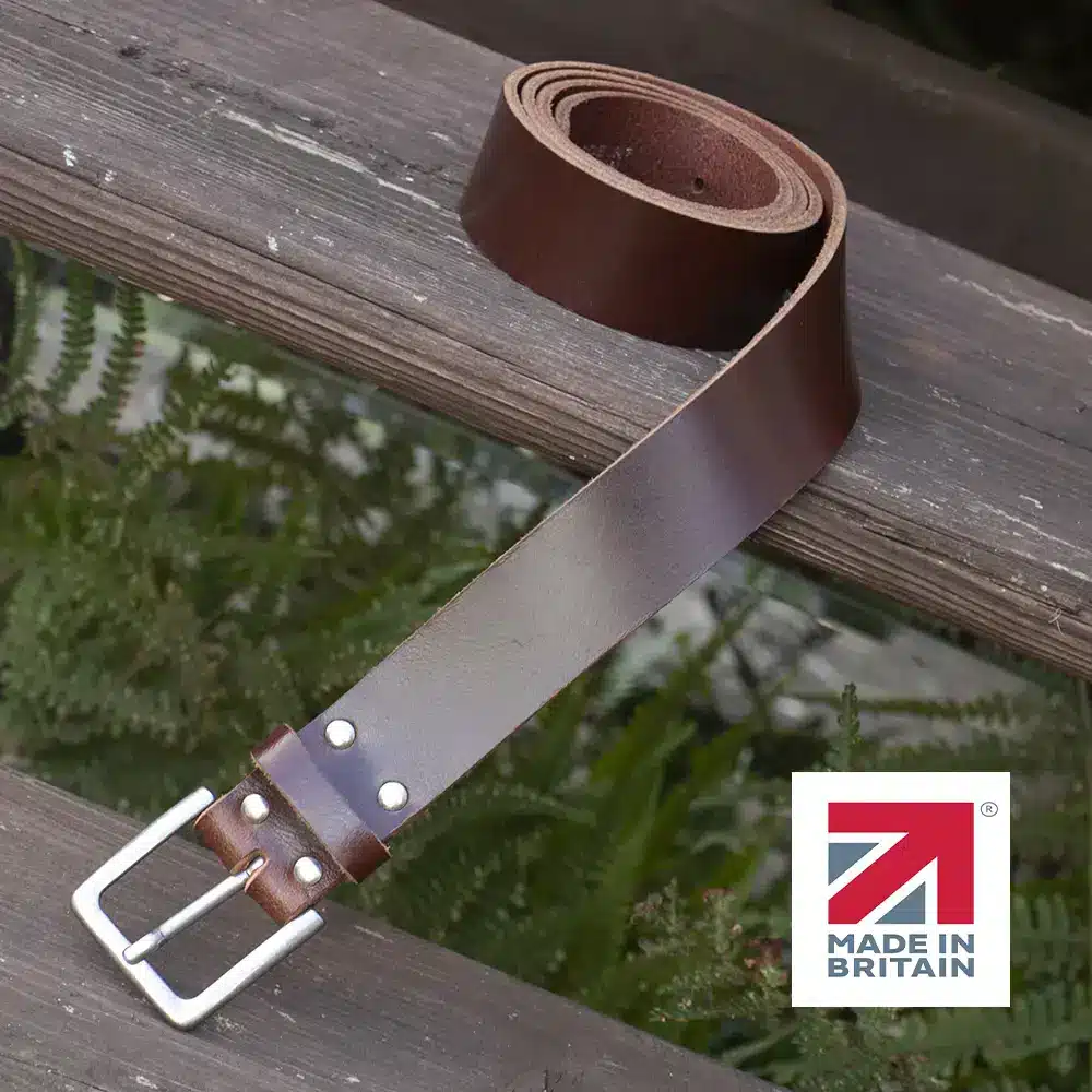 brown handmade in britain leather belt on a wooden step