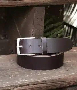 premium dark brown english hide leather belt on a wooden step