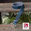 blue handmade in britain leather belt on a wooden step