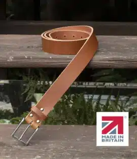 tan colour handmade in britain leather belt on a wooden step