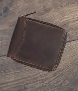 Handcrafted men’s oiled leather wallet with RFID protection, zip-around security, and smart organization. Durable, stylish, and built for adventure.